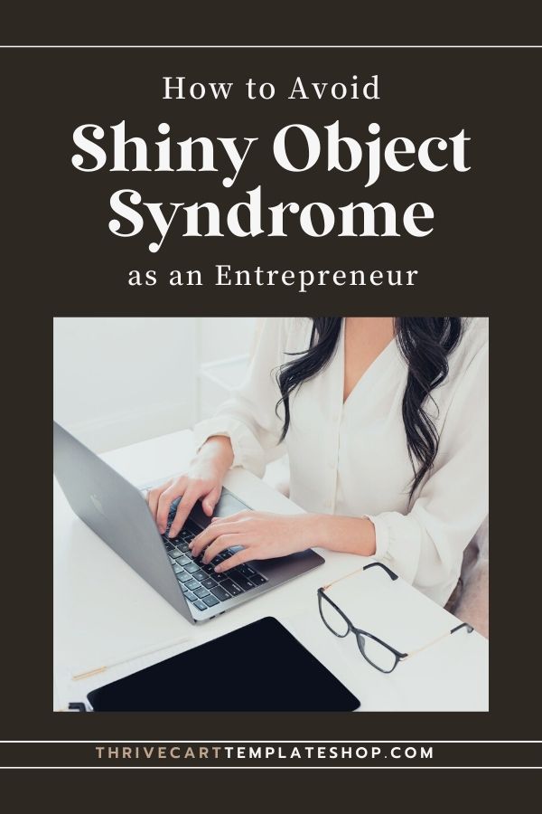 woman with dark hair working at a computer struggling with shiny object syndrome